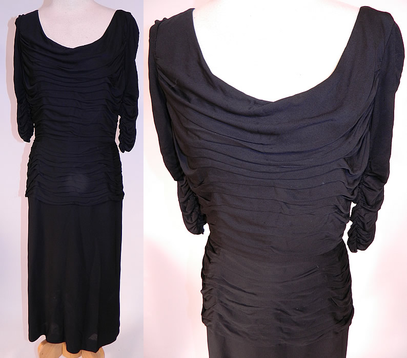 Vintage Black Silk Jersey Pleated Gathering Sexy Sheath Cocktail Dress
This vintage black silk jersey pleated gathering sexy sheath cocktail dress dates from the 1960s. It is made of a black silk jersey knit fabric, with pleated gathering layered details on the top. This sexy wiggle cocktail party dress has a form fitting sheath style, with a draping low rounded scoop front neckline, plunging V back, gathering along the 3/4 length sleeves, more pleated gathering along the peplum hips, a mid length pencil skirt, fully lined and has a back zipper closure.