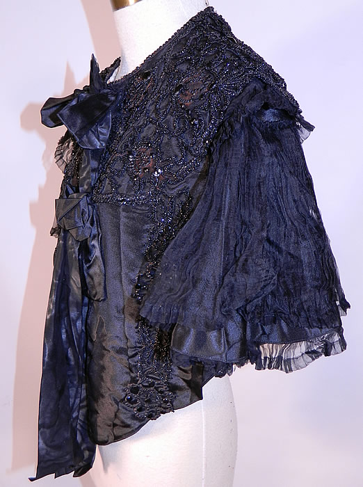 Victorian Black Silk Jet Beaded Mourning Mantle Dolman Cloak Cape Capelet
The cape measures 19 inches long, with a 36 inch bust. 