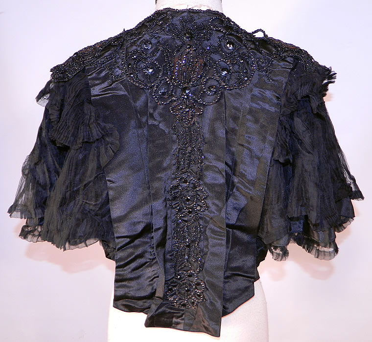 Victorian Black Silk Jet Beaded Mourning Mantle Dolman Cloak Cape Capelet
This is truly a wonderful piece of antique Victoriana mourning wearable art!