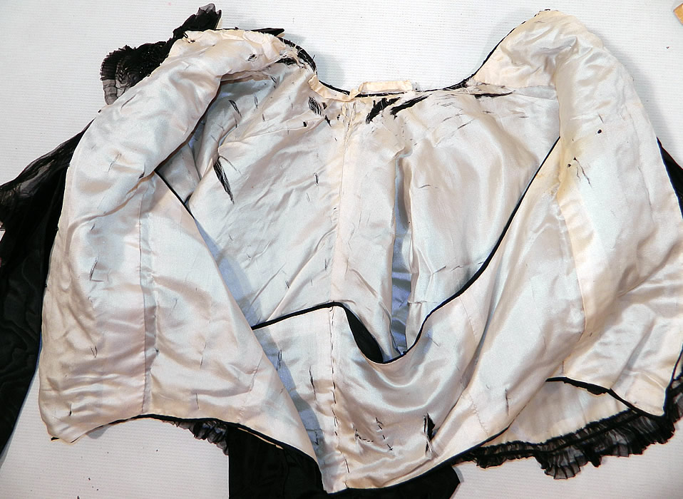 Victorian Black Silk Jet Beaded Mourning Mantle Dolman Cloak Cape Capelet
It is in good as-is condition, with a few brown rust stains under the beadwork in areas and the silk lining inside has several frayed splits (see close-ups). 