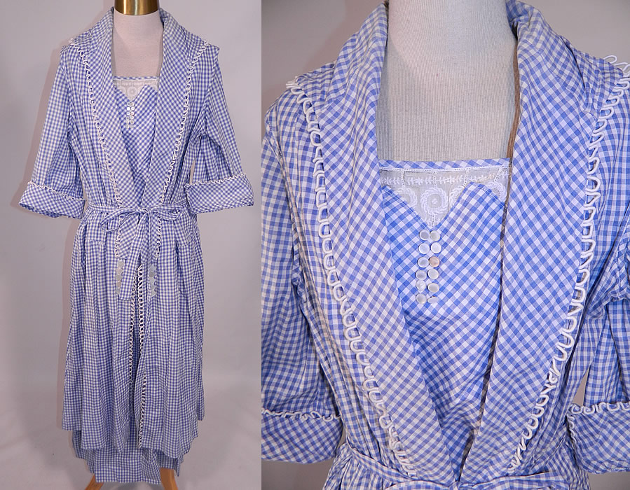 Edwardian Blue & White Gingham Check Cotton Pinafore Belted Day Dress
This vintage Edwardian era blue and white gingham check cotton pinafore belted day dress dates from 1915. It is made of a blue and white gingham check cotton fabric, with white silk rope loop trim edging, mother of pearl button trim accents and an embroidered white batiste lace yoke insert.