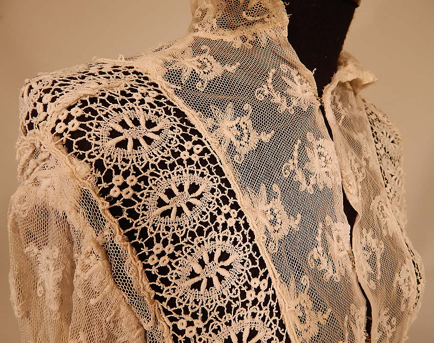 Vintage Edwardian Ecru Cream Tambour Embroidery Net Mixed Lace Blouse Jacket
This lovely lace blouse style jacket has an open front with hook closures, a fold over high neck collar, long tapered sleeves with fitted lace trim cuffs and is sheer completely unlined.