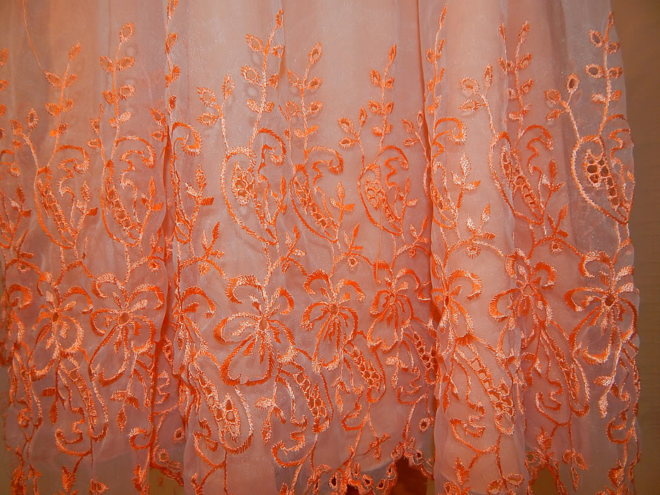 Vintage Peach Pastel Organdy Eyelet Embroidered One Shoulder Circle Skirt Dress
The dress measures 43 inches long, with a 28 inch waist and 34 inch bust. It is in excellent condition. This is truly a wonderful piece of wearable art!