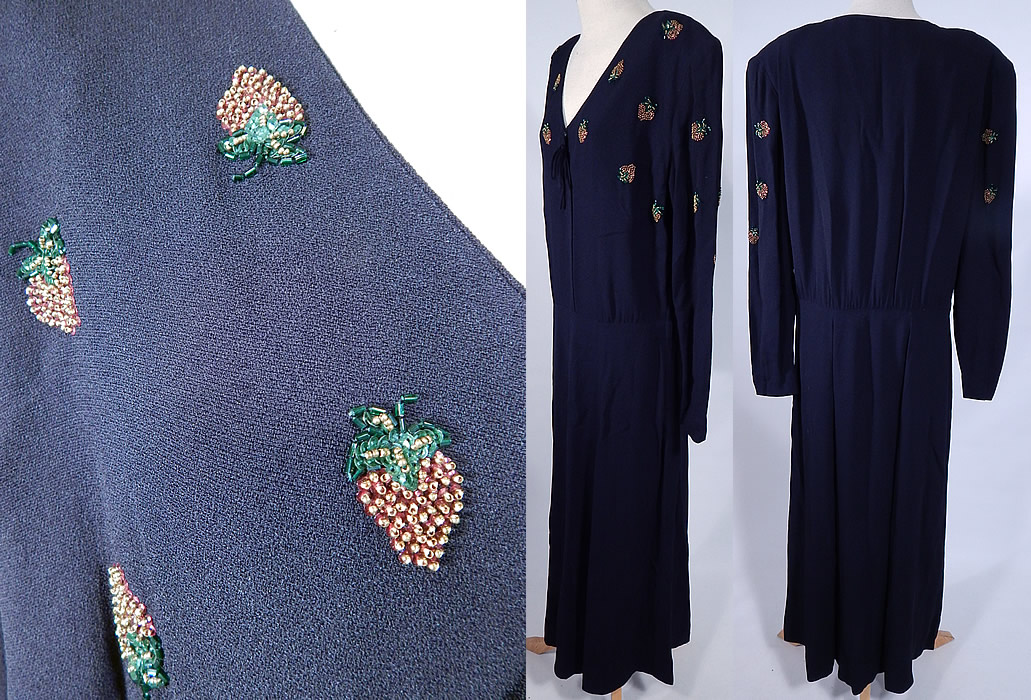 Vintage Eisenberg Originals Black Silk Crepe Strawberry Beaded Cocktail Dress
This beautiful beaded cocktail dress has broad shoulder padding, long full sleeves with gathered cuffs, a V front neckline with bow trim snap closure, a fitted waist, long mid length skirt and side zipper closure. There is an "Eisenberg Originals" designer label sewn inside and was made with quality construction workmanship.