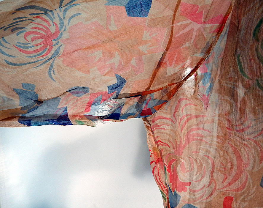 Vintage Art Deco Colorful Abstract Print Silk Chiffon Drop Waist Dress & Jacket
There is a matching fabric coat jacket, with long sleeves, flared cuffs, an open front with tie waist closure and is sheer, unlined. The jacket measures 27 inches long, with 40 inch hips, a 34 inch waist, 40 inch bust and 25 inch long sleeves. The dress is in good condition and the jacket has a few frayed rips under the arms (see close-up). This is truly a wonderful piece of wearable art!