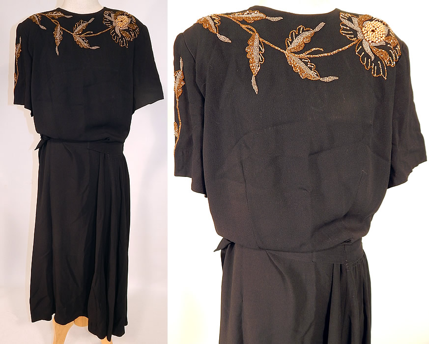 Vintage Eisenberg Originals Black Silk Crepe Gold Flower Beaded Cocktail Dress
This vintage Eisenberg Originals black silk crepe gold flower beaded cocktail dress dates from the 1940s. It is made of a black silk crepe de fabric, with a variety of gold beads and gold pearls down in an elaborate beaded flower design along the top front neckline.