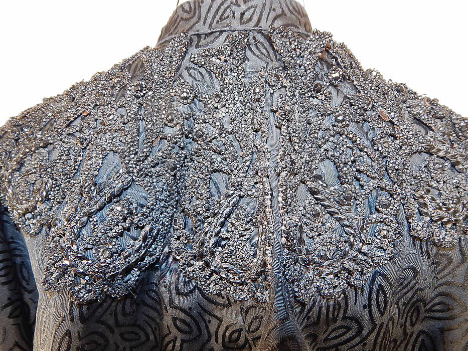 Victorian Black Silk Damask Brocade Jet Beaded Trim Mourning Cloak Cape
The cape measures 15 inches long and 107 inches bottom circumference. 