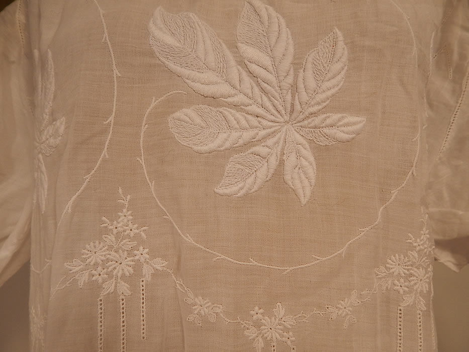Vintage White Cotton Batiste Embroidered Forget-me-not Floral Leaf Drop Waist Dress
This beautiful white work summer dress is loose fitting, with a drop waist, short sleeves, a scalloped hemline skirt, snap closures along the shoulders and is sheer, completely unlined. 
