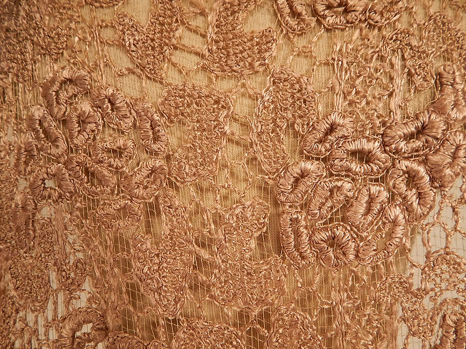Vintage Ecru Embroidered Crochet Lace Net Tabard Tunic Flapper Dress
This lovely lace tunic tabard style flapper dress has a front and back long floor length panels, with open sides, loose fitting, sleeveless, with snap closures along the shoulders and is sheer because it is unlined worn as an overdress.
