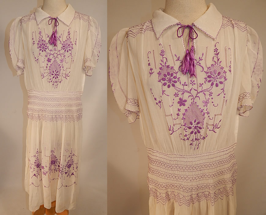 Vintage White Cotton Purple Embroidered Smocking Boho Peasant Drop Waist Dress
This vintage white cotton purple embroidered smocking boho peasant drop waist dress dates from the 1920s. It is made of a white sheer cotton batiste fabric, with drawn cut work and purple raised padded satin stitch, French knot hand embroidery work and smocking details with a floral vine leaf design. 