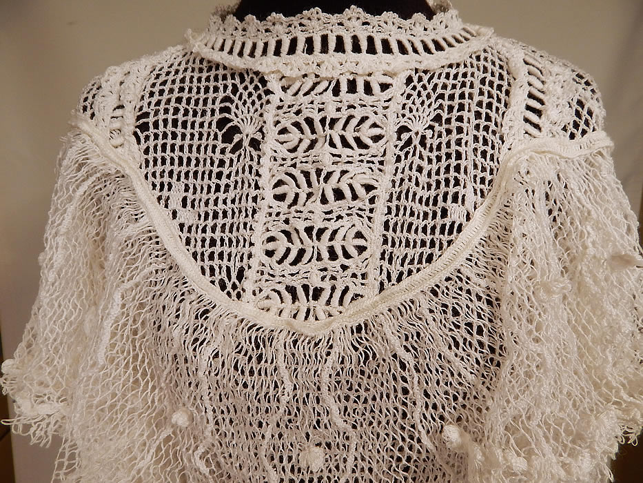 Vintage Victorian Style White Crochet Lace Flounce Ruffle Boho Maxi Dress
This beautiful boho chic Victorian inspired maxi dress has a flounce ruffle shawl collar, long sleeves, a long full skirt with ruffle trim, a belted sash tie back, crochet button closures down the back and is sheer, unlined.