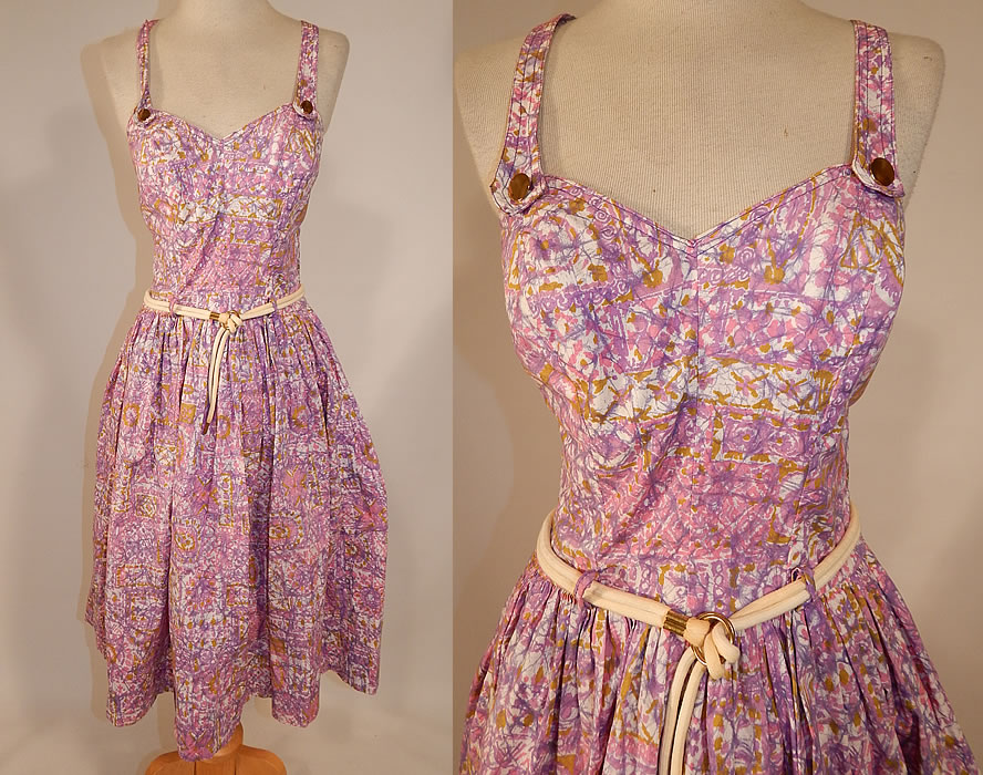 Vintage Catalina Sportswear Pink Cotton Novelty Print Belted Circle Skirt Dress
This vintage Catalina Sportswear pink cotton novelty print belted circle skirt dress dates from the 1950s. It is made of shades of pink, purple, gold and white cotton fabric, with an abstract floral patchwork novelty print design.
