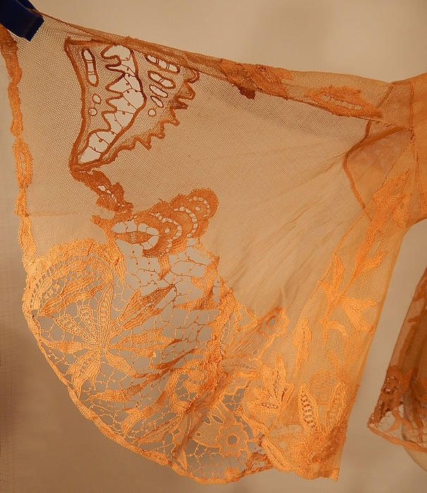 Vintage Antique Peach Ecru Net Battenburg Lace Coat Jacket Bell Sleeves
The jacket measures 22 inches long, with a 38 inch waist, 38 inch bust, 14 inch back and 24 inch long sleeves.