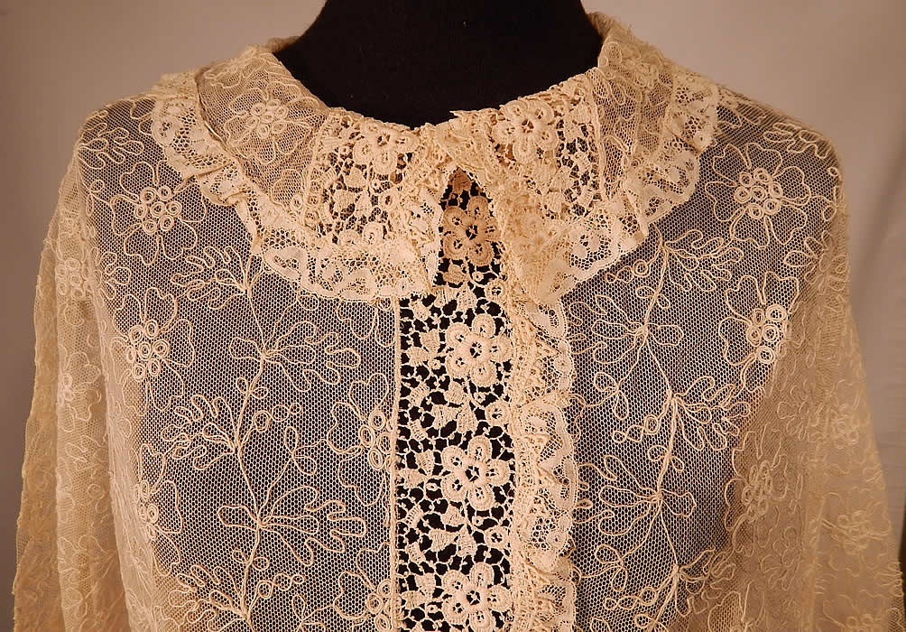 Vintage Ecru Cream Soutache Tambour Embroidery Tulle Net Lace Blouse Top
This lovely lace shirt top blouse is a loose fitting, a long mid length, with peter pan rounded fold over collar, long full sleeves with fitted lace cuffs, a key hole opening button back closure and is sheer, unlined. 