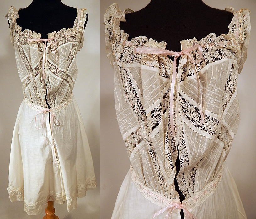 Edwardian Windowpane White Cotton Batiste Lace Teddy Camiknickers Camisole Bloomers
This antique Edwardian era white cotton batiste lace teddy camiknickers camisole bloomers dates from 1910. It is made of a white cotton batiste fabric, with a sheer windowpane check striped top and lace trim edging. This lovely lacy lingerie undergarment one piece teddy camiknickers has a camisole corset cover top attached to bloomers, with a lace ruffle trim neckline, armholes, waist and pink ribbon drawstring closures on the front and button closures.