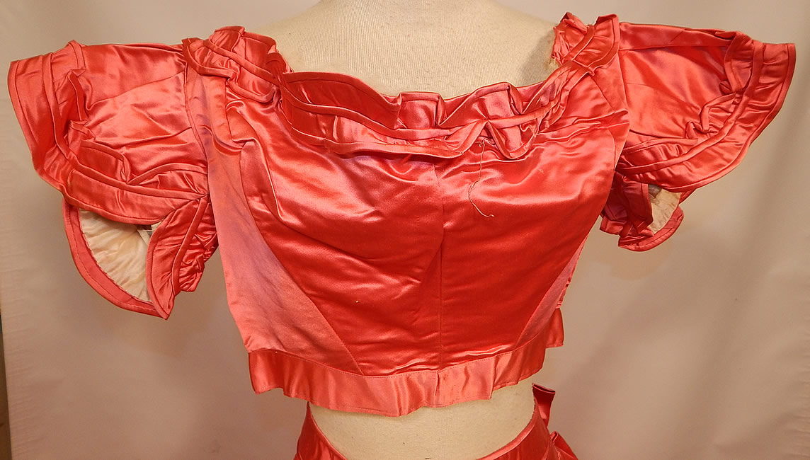 Victorian Magenta Pink Silk Ball Gown With Train Skirt 2 Bodices & Bow Belt
The second bodice has short cap sleeves, with scalloped ruffle trim, has an off the shoulder neckline, corseted back lacing closure and is fully lined. 