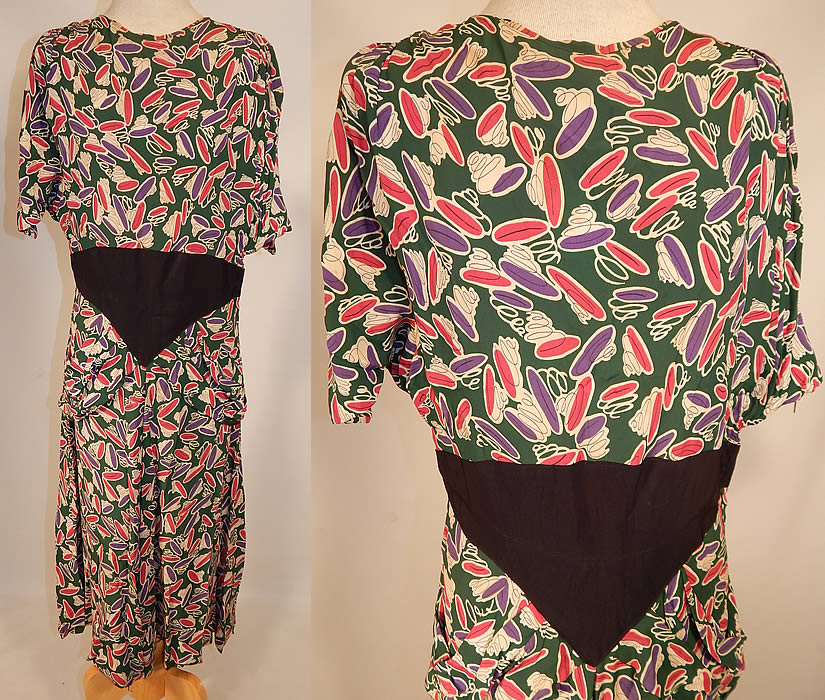 Vintage Green Pink Purple Coil Springs Abstract Novelty Print Rayon Peplum Dress
This vintage green, pink, purple coil springs abstract novelty print rayon peplum dress dates from the 1940s. It is made of a dark green color rayon fabric with pink, purple and white coil springs abstract print pattern designs.