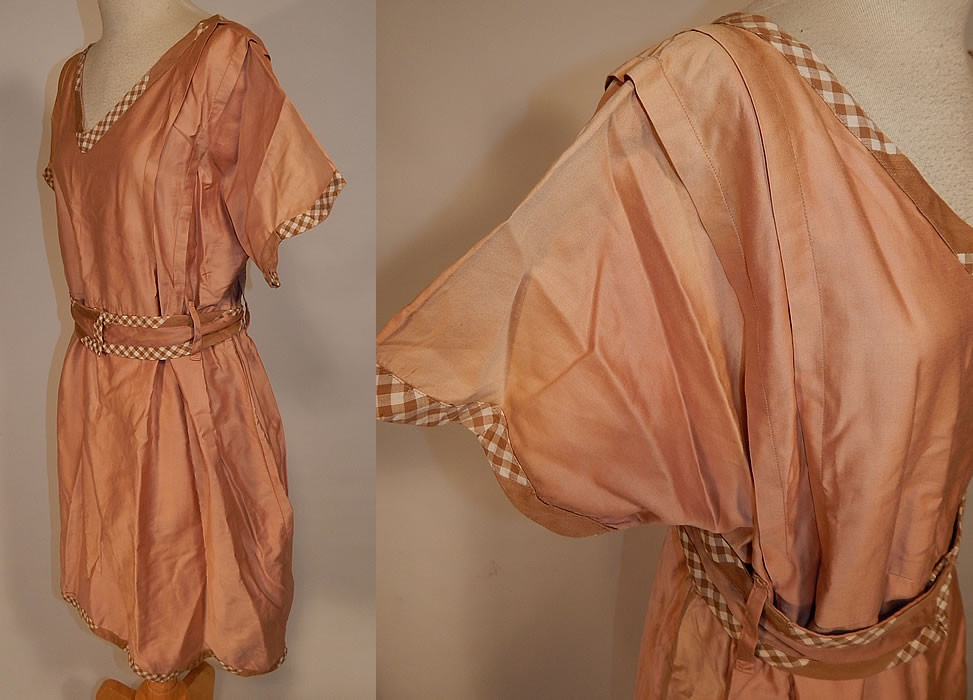 Vintage Edwardian Tan Cotton Gingham Trim Belted Bathing Swimsuit Dress
This wonderful women's old fashioned bathing suit costume dress has a V front neckline, pleated trim along the shoulders, short sleeves, a fitted waist, matching fabric belt with snap closures on the front and is missing the bloomers pantaloons which would have been worn underneath.