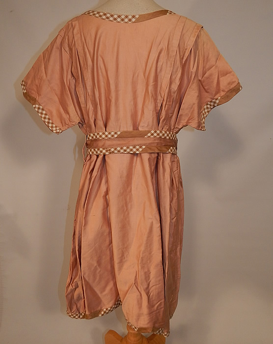 Vintage Edwardian Tan Cotton Gingham Trim Belted Bathing Swimsuit Dress
The dress measures 36 inches long, with a 34 inch waist, 40 inch bust and 28 inch belt. It is in good condition, with only some slight fade discoloration in areas on the top (see close-up). This antique authentic "bathing beauty" costume is truly a rare color and wonderful piece of wearable art!