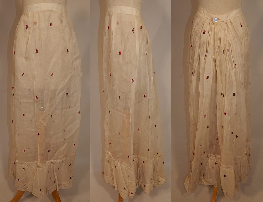 Victorian White Cotton Organdy Fabric Red Berry Polka Dot Embroidered Skirt
This antique Victorian era white cotton organdy fabric red berry polka dot embroidered skirt dates from 1890. It is made of a sheer white light weight crisp cotton organdy fabric, with a red and white stitched embroidered berry polka dot design.