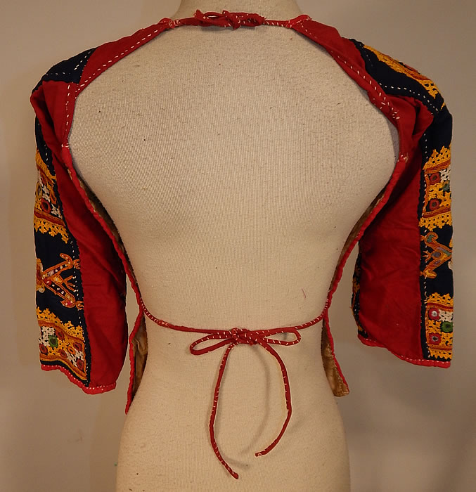 Vintage Antique Indian Gujarati Kutch Work Embroidered Mirror Choli Boho Blouse Top
The top measures 18 inches long, with a 26 inch bust, 22 inch waist and 12 inch long sleeves. 
