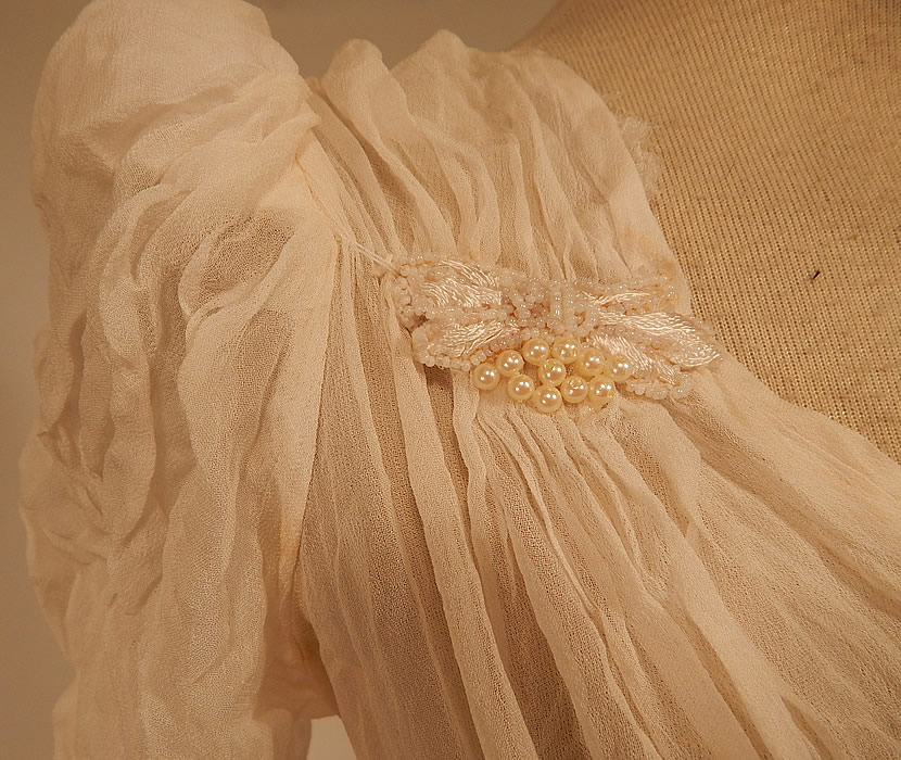 Vintage White Silk Crepe de Chine Pearl Beaded Wedding Gown Dress Long Train Skirt
 The dress measures 53 inches long in the front, 89 inches long in the back, a 26 inch waist and 34 inch bust.