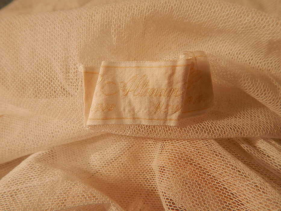 Vintage B. Altman & Co White Cotton Tulle Net Embroidered Lace Drop Waist Dress
It is in good as-is condition, has not been cleaned, with some yellowing discoloration staining on the front top and a few small frayed holes. This is truly a wonderful piece of wearable lace art which would be great for design or restoration!