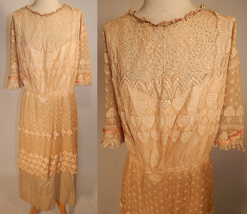 Edwardian Belle Epoque Cream Embroidered Net Lace Beaded Rosette Dress
This Edwardian era Belle Epoque antique cream embroidered net lace beaded rosette dress dates from 1915. It is made of an off white cream color sheer net, lace fabric, with raised padded satin stitch embroidery work, tiny pink beads, silver sequin beaded accents on the top and silk rosette ribbon work trim around the neckline, sleeve cuffs.