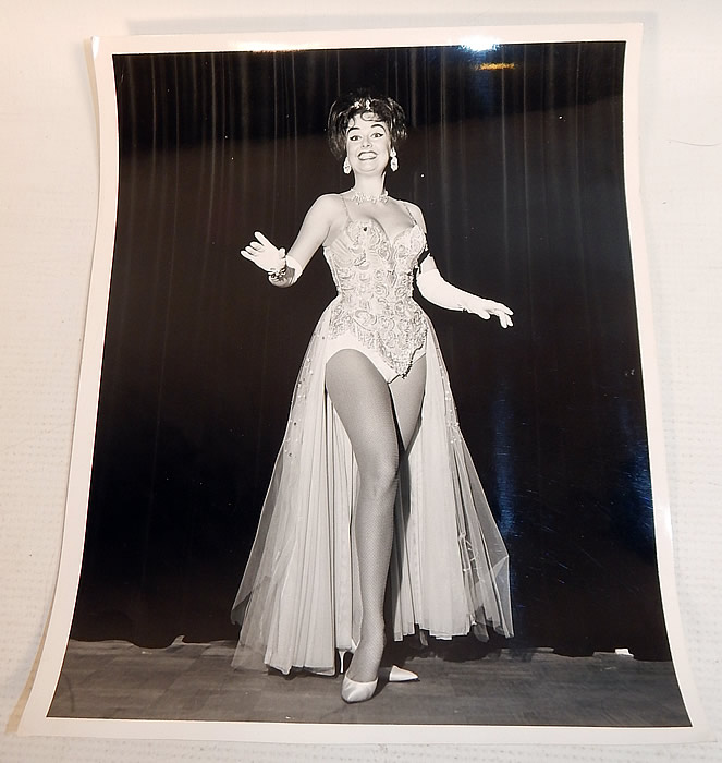 Vintage White Silk de Chine Silver Beaded One Shoulder Grecian Goddess Gown
This custom made evening gown is from the estate of Karen Wessler who performed on the Tennessee Ernie Ford Show as one of "The Top Twenty", Ernie's back-up group (see publicity photo stills below).