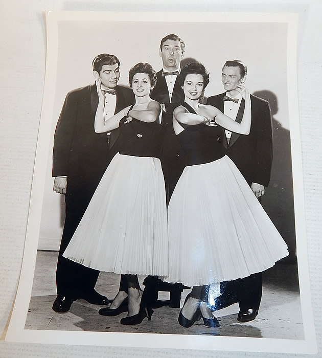 Vintage White Silk de Chine Silver Beaded One Shoulder Grecian Goddess Gown
This custom made evening gown is from the estate of Karen Wessler who performed on the Tennessee Ernie Ford Show as one of "The Top Twenty", Ernie's back-up group (see publicity photo stills below).