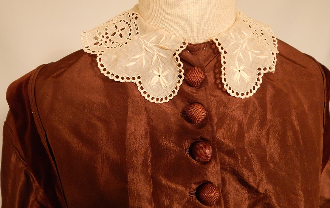Victorian Civil War Era Brown Silk Taffeta Hoop Skirt Dress & Velvet Bow Belt Sash
It is made of a chocolate brown color silk taffeta fabric, with brown velvet trim edging. This beautiful brown gown has a long floor length very full hoop skirt (hoop not included), with fitted bodice, long sleeves, a white cotton batiste broderie anglaise eyelet embroidery cutwork lace collar, silk covered button front closure and is fully lined.