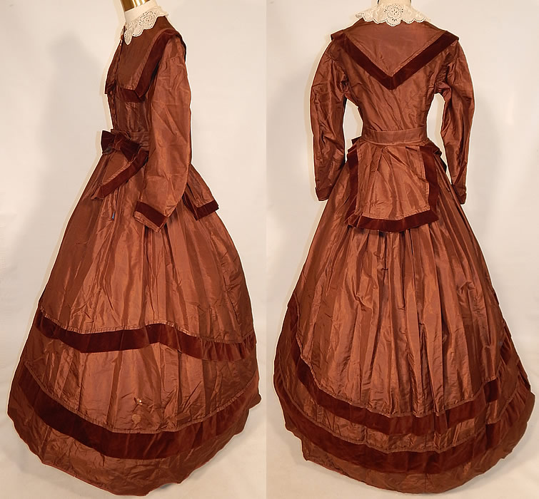 Victorian Civil War Era Brown Silk Taffeta Hoop Skirt Dress & Velvet Bow Belt Sash
The dress measures 57 inches long, with a 26 inch waist, 34 inch bust and 19 inch long sleeves. Included is a matching fabric belted bow sash with apron back drape, hook closure front waistband and has a 24 inch waist. 