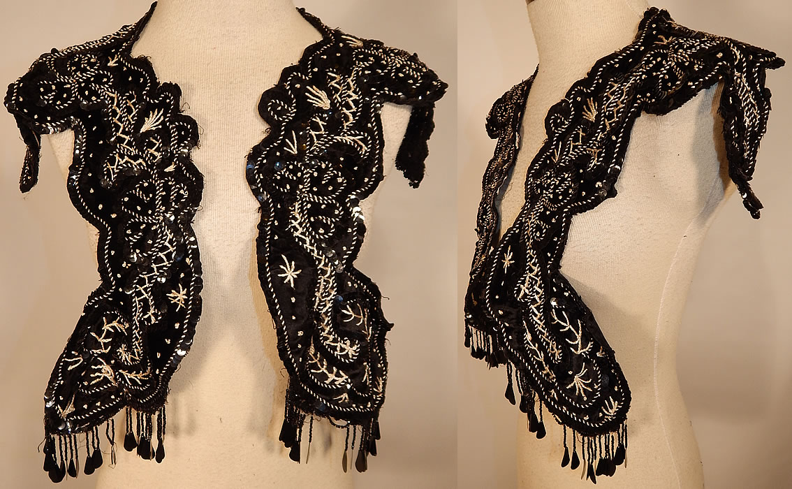 Edwardian Black Silk Velvet White Soutache Embroidery Dress Trim Collar
This Edwardian era antique black silk velvet white soutache embroidery dress trim collar dates from 1910. It is made of a black silk velvet fabric, with contrasting white French knot, soutache embroidery work stitching done in a decorative design and black beaded sequin fringe trim hanging down from the ends.