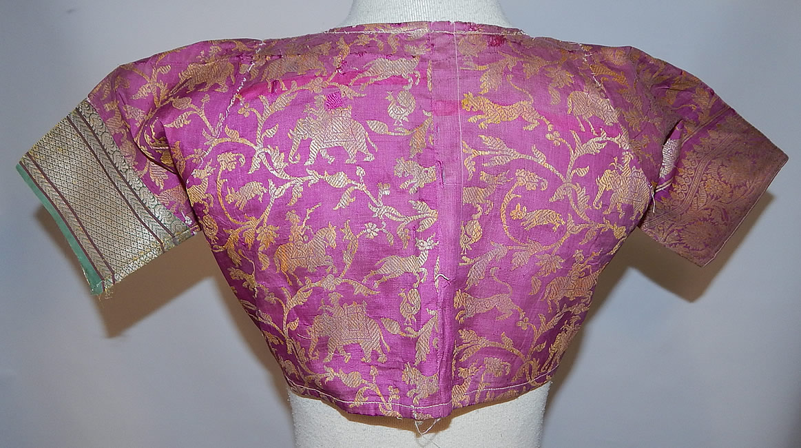 Vintage 19th Century Indian Purple Silk Sari Gold Lamé Lame Choli Crop Top Blouse
The top measures 10 inches long, with a 30 inch bust and 28 inch waist. 