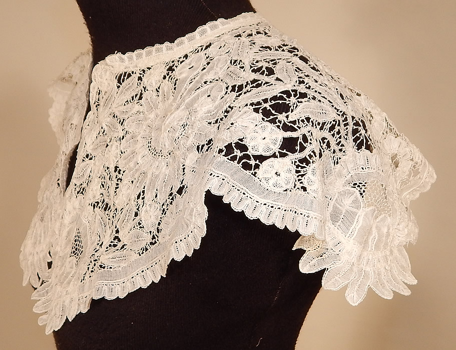 Victorian Antique Hand Made White Duchesse Bobbin Lace Shawl Collar
It is hand made of a sheer white filmy linen lace, with veined, raised threads flowers and leaves, joined by braided plaits. 