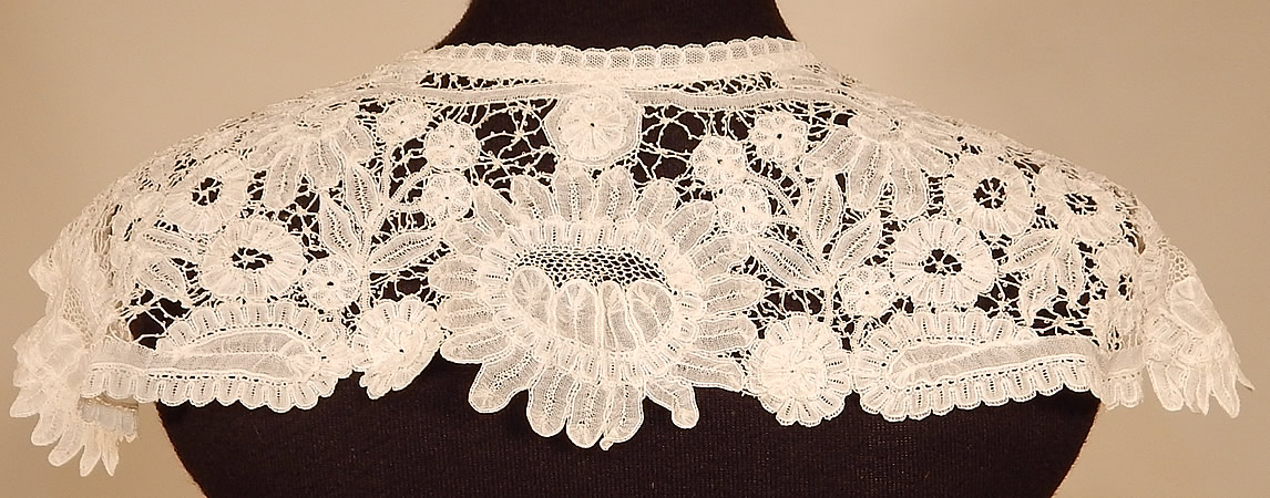 Victorian Antique Hand Made White Duchesse Bobbin Lace Shawl Collar
This lovely lace shawl collar dress trim has scalloped trim edging, an open front with no closure and is sheer, unlined.
