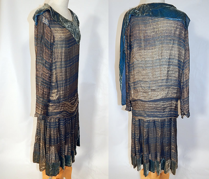 Vintage Art Deco Striped Blue & Gold Lam&eacute; Lame Velvet Drop Waist Flapper Dress
The dress measures 43 inches long, with 34 inch hips, a 34 inch waist, 36 inch bust and 23 inch long sleeves. It is in good condition, with only some slight discoloration along the blue velvet trim and there are 2 rhinestones missing on the buckle trim (see close-up). This is truly a wonderful piece of Art Deco wearable textile art!
