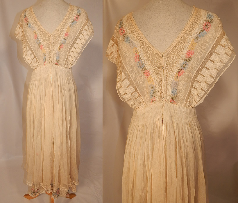 Edwardian Embroidered Pastel Flowers Cream Net Batiste Lace Dress Gown
The dress measures 49 inches long, with 44 inch hips, a 30 inch waist and 36 inch bust. 