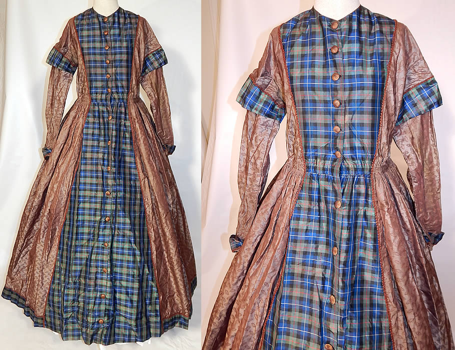 Victorian Civil War Era Silk Brocade Plaid Hoop Skirt Wrapper Gown Dress
This antique Victorian Civil War era silk brocade plaid hoop skirt wrapper gown dress dates from the 1860s. It is made of an iridescent brownish gray taupe color silk damask weave brocade with a holly leaf print design woven into the fabric and a blue, green, black, red plaid pattern silk taffeta fabric accent. 