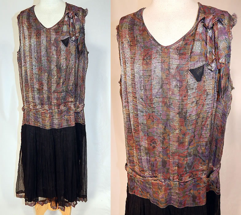Vintage Art Deco Silver Lam&eacute; Lame Black Silk Chiffon Pleated Skirt Drop Waist Dress
This vintage Art Deco silver lam&eacute; black silk chiffon pleated skirt drop waist dress dates from the 1920s. It is made of silver lam&eacute; metallic silk fabric with a colorful woven striped abstract Art Deco design and a sheer black silk chiffon fabric pleated skirt bottom.
