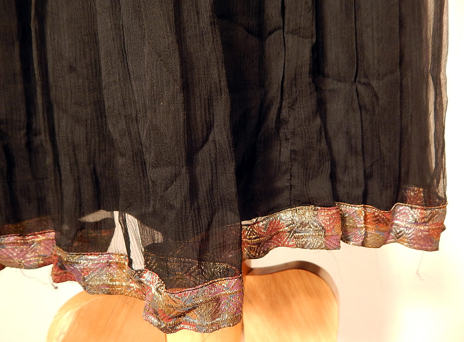 Vintage Art Deco Silver Lam&eacute; Lame Black Silk Chiffon Pleated Skirt Drop Waist Dress
The dress measures 46 inches long, with a 38 inch waist and 42 inch bust. It is in good as-is condition, with some slight tarnish discoloration in areas and there is some fraying around the arm holes which needs finishing. This is truly a wonderful piece of wearable art!