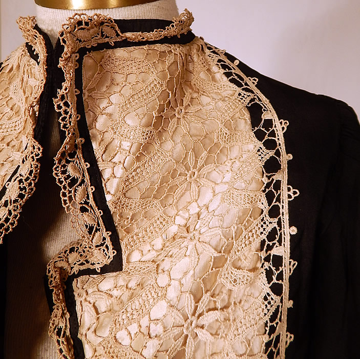 Victorian Black Silk White Lace Bolero Spencer Jacket Cropped Top
This beautiful bolero jacket short cropped spencer style top, has an open front with no closure, a wide lapel fold over collar, gathered shoulders with long tapered sleeves and is fully lined with stays boning sewn inside.