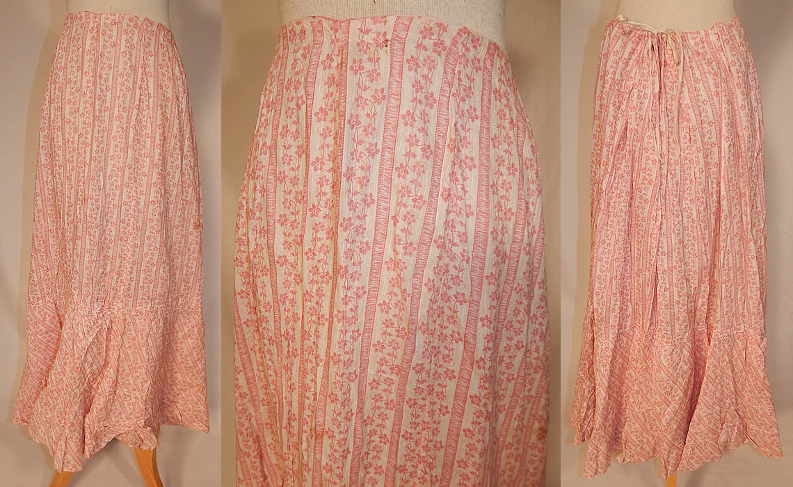 Victorian Red & White Stripe Cotton Calico Floral Print Petticoat Skirt
This antique Victorian era red and white stripe cotton calico floral print petticoat skirt dates from 1880. It is made of a white cotton batiste fabric, with a red striped floral calico print pattern design.