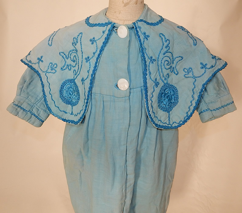 Edwardian Blue Embroidered Soutache Braided Trim Childs Winter Coat
This charming child's wonderful winter traveling coat has a loose fitting, long full style, with an embroidered sailor style shawl collar, long sleeves with fitted cuffs, 2 large mother of pearl buttons down the front for closure and is fully lined inside. 