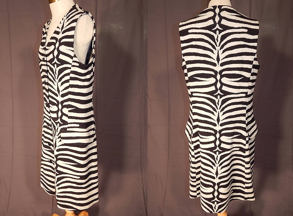 Vintage Kimberly Virgin Wool Knit Black & White Zebra Stripe Shift Dress
This sensational animal print mod dress has a loose fitting straight shift style, sleeveless, with a button down front closures, flap pockets on the hips and is unlined.