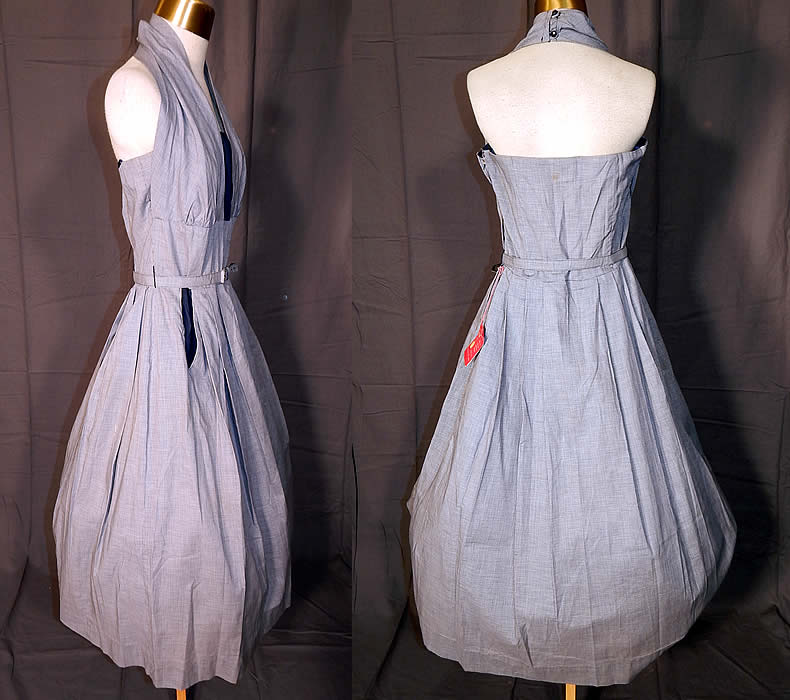 Vintage Jonathan Logan Navy Blue Houndstooth Cotton Circle Skirt Halter Dress
It is made of a navy blue and white cotton fabric with a houndstooth pattern print. This sensational summer sun dress has a halter top style with button back neck strap, a full circle skirt with pockets, matching fabric belt, side zipper closure and is unlined, with stays, boning sewn inside. 