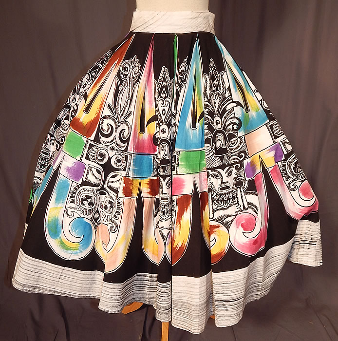 Vintage Hand Painted Mexican Mayan Aztec Warrior Print Cotton Circle Skirt
This vintage hand painted Mexican Mayan Aztec warrior print cotton circle skirt dates from the 1950s. It is made of a cotton fabric, with a black and white, colorful hand painted air brushed silk screen design of Mexican Mayan Aztec warriors print.