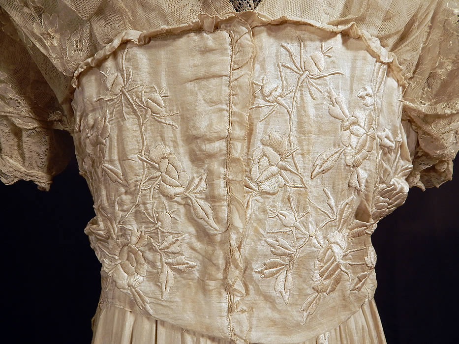 Vintage Robe de Style White Silk Embroidered Piano Shawl Lace Wedding Dress
It is in good condition, but has not been cleaned and has a small faint age spot stain on the lace side skirt panel with a few small frayed holes. This is truly a rare and unique piece of wearable bridal wedding textile art!
