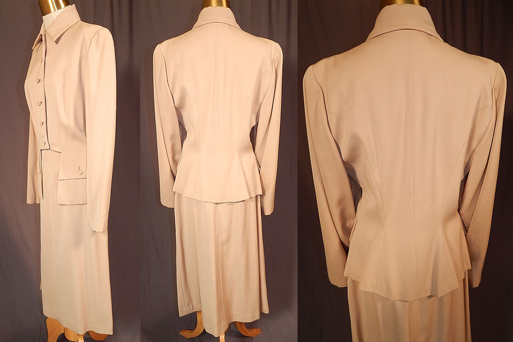 Vintage Susan Garber Originals Beige Gabardine Suit Jacket Pencil Skirt
This stunning tailored womens suit jacket has a cutaway bottom front, with button flap pockets, a skirted back, fold over collar, long full sleeves, fabric covered square dice shaped stitched buttons down the front for closure and is fully lined.