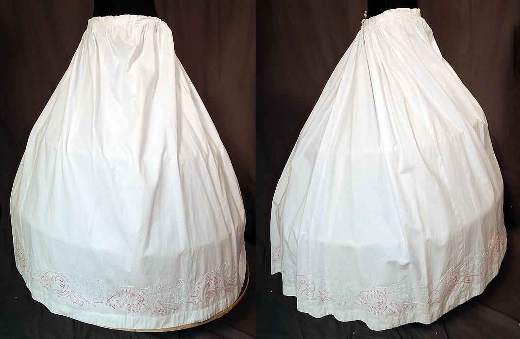 Victorian White Cotton Red Soutache Stitched Embroidery Full Petticoat Skirt
This antique Victorian Civil War era white cotton red soutache stitched embroidery full petticoat skirt dates from the 1860s. It is made of a crisp white cotton fabric, with red, white and blue gray accented decorative stitched soutache embroidery work along the bottom hem. 